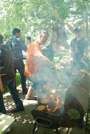 A group of people around a barbecue